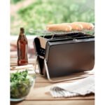 Stainless steel portable suitcase barbecue with a layer grill and stand at the bottom.